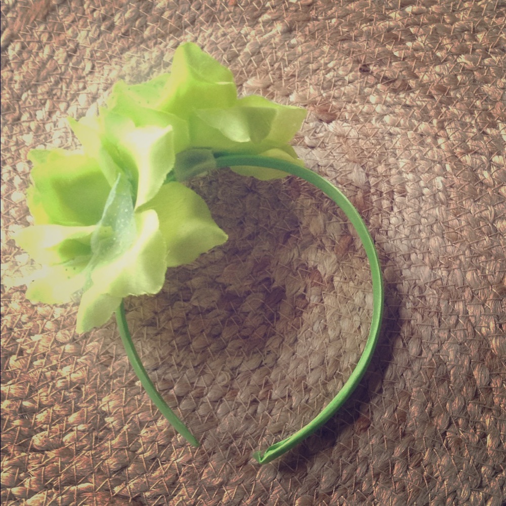 Green headband from Claire's with flower on it.